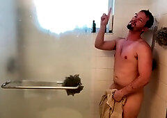 man showers and shows his big cock