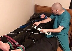 Rubber Boy in Leather Bondage