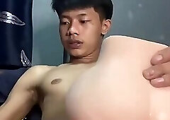 Thai boy jerking off with a toy alone