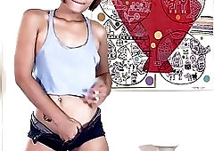 Frisky redhead ladyboy spreads her cute ass for the camera